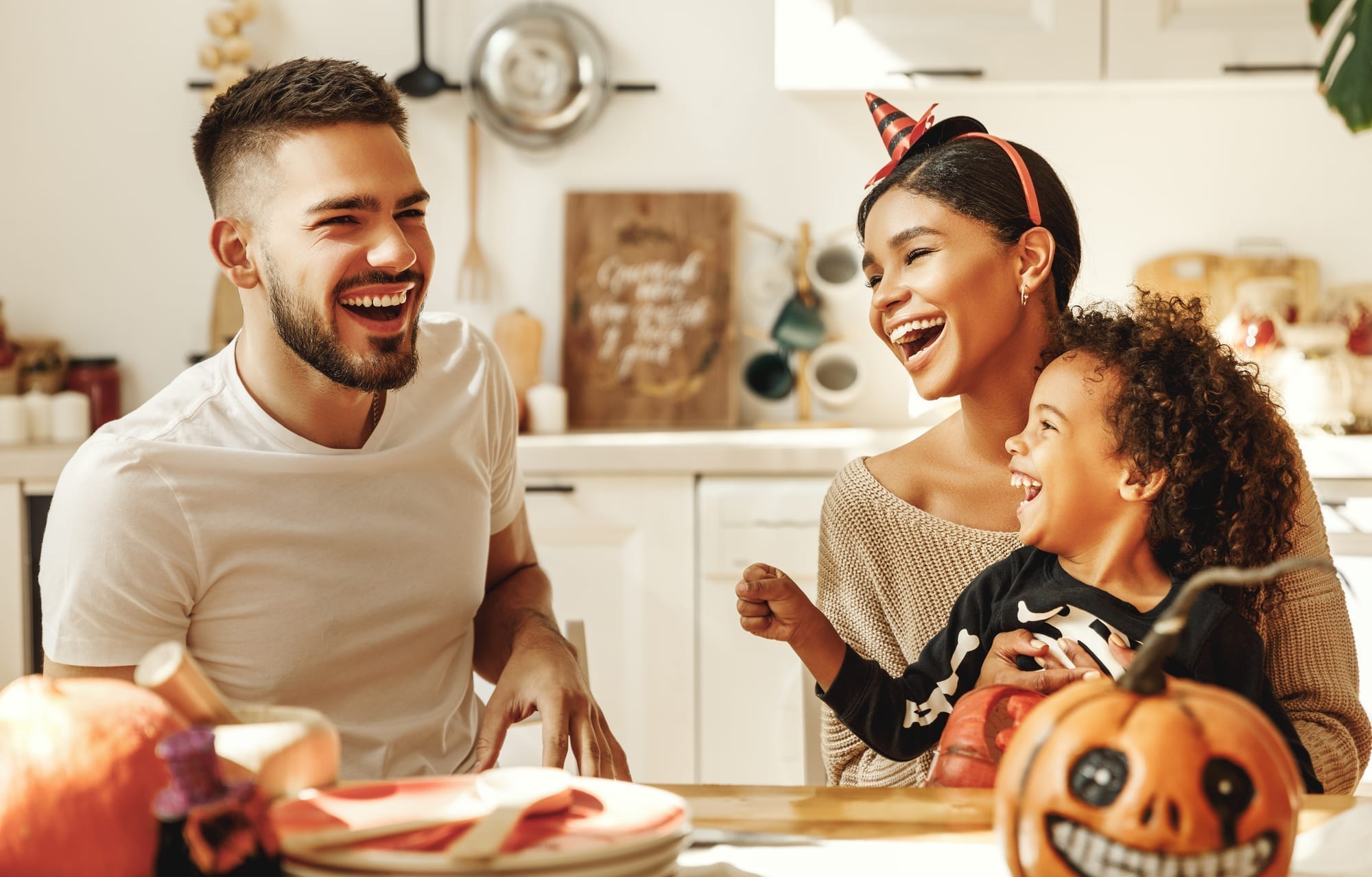 happy family with Halloween decor