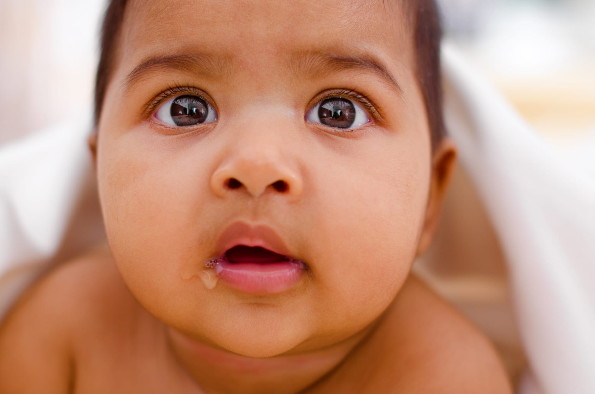 close up of baby with drool