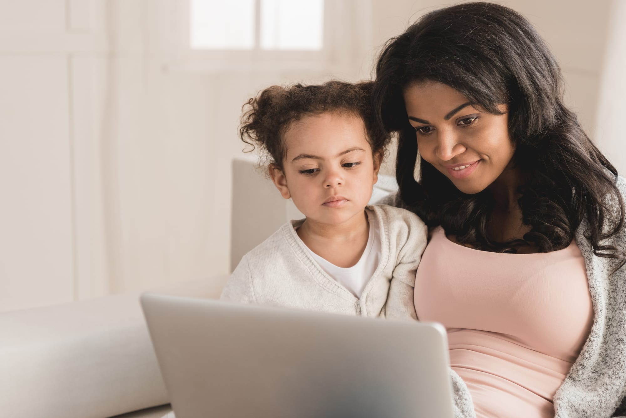 mom and daughter on laptop