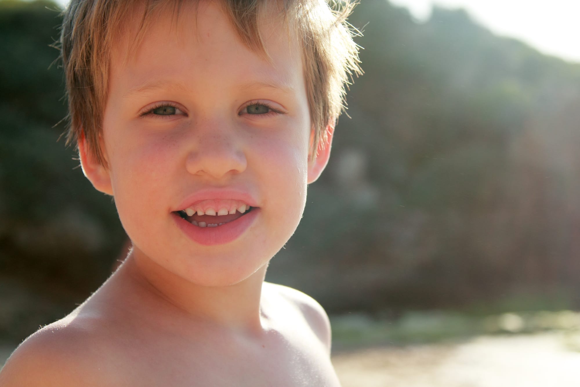 close up of little boy at the lake