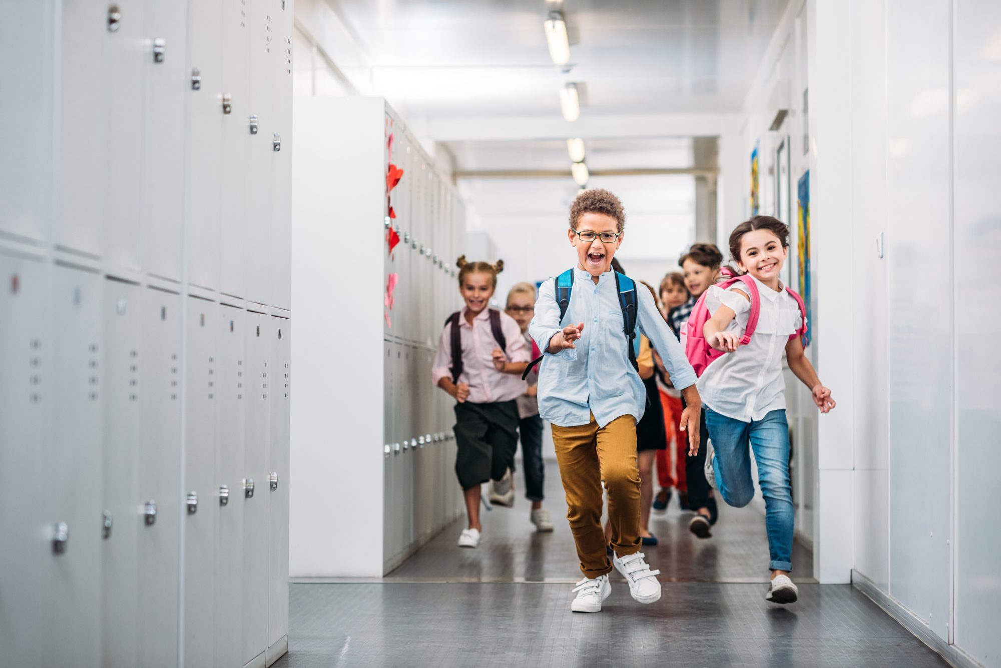 children running in the hallway in school