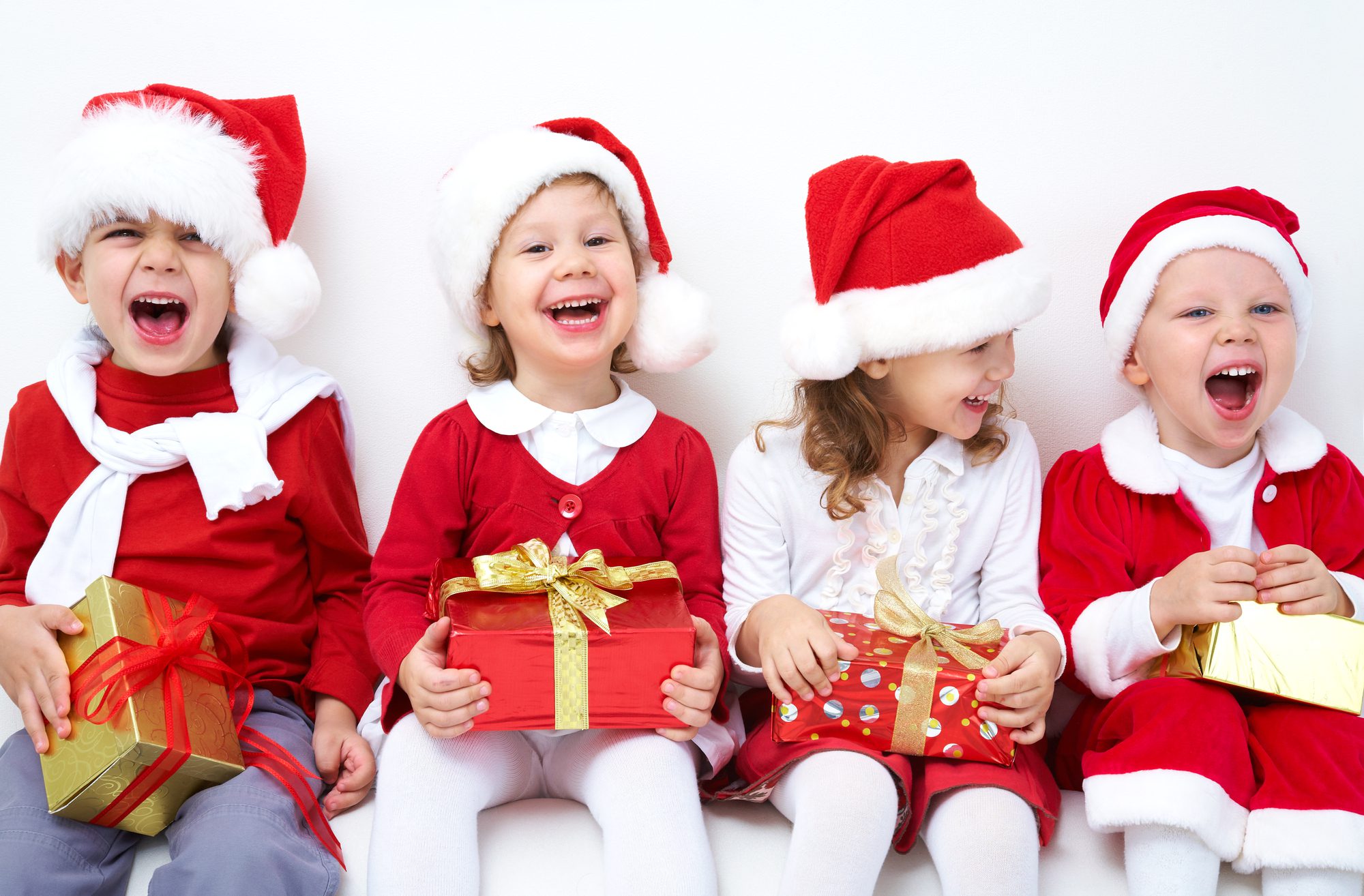 four children celebrating Christmas activities in Overland Park, KS
