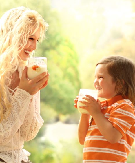 mother and child enjoying a glass of milk