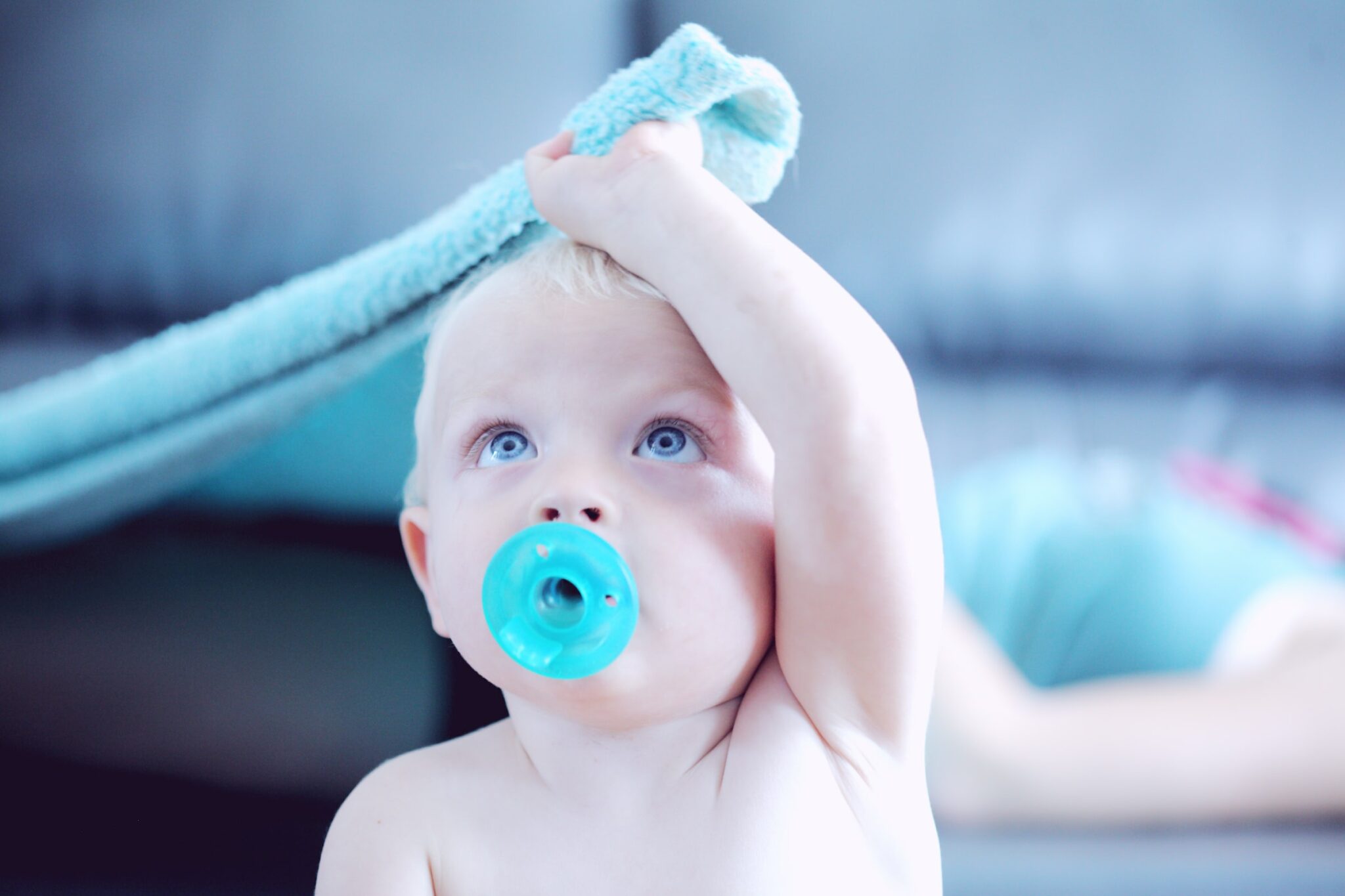 Baby sucking on a pacifier