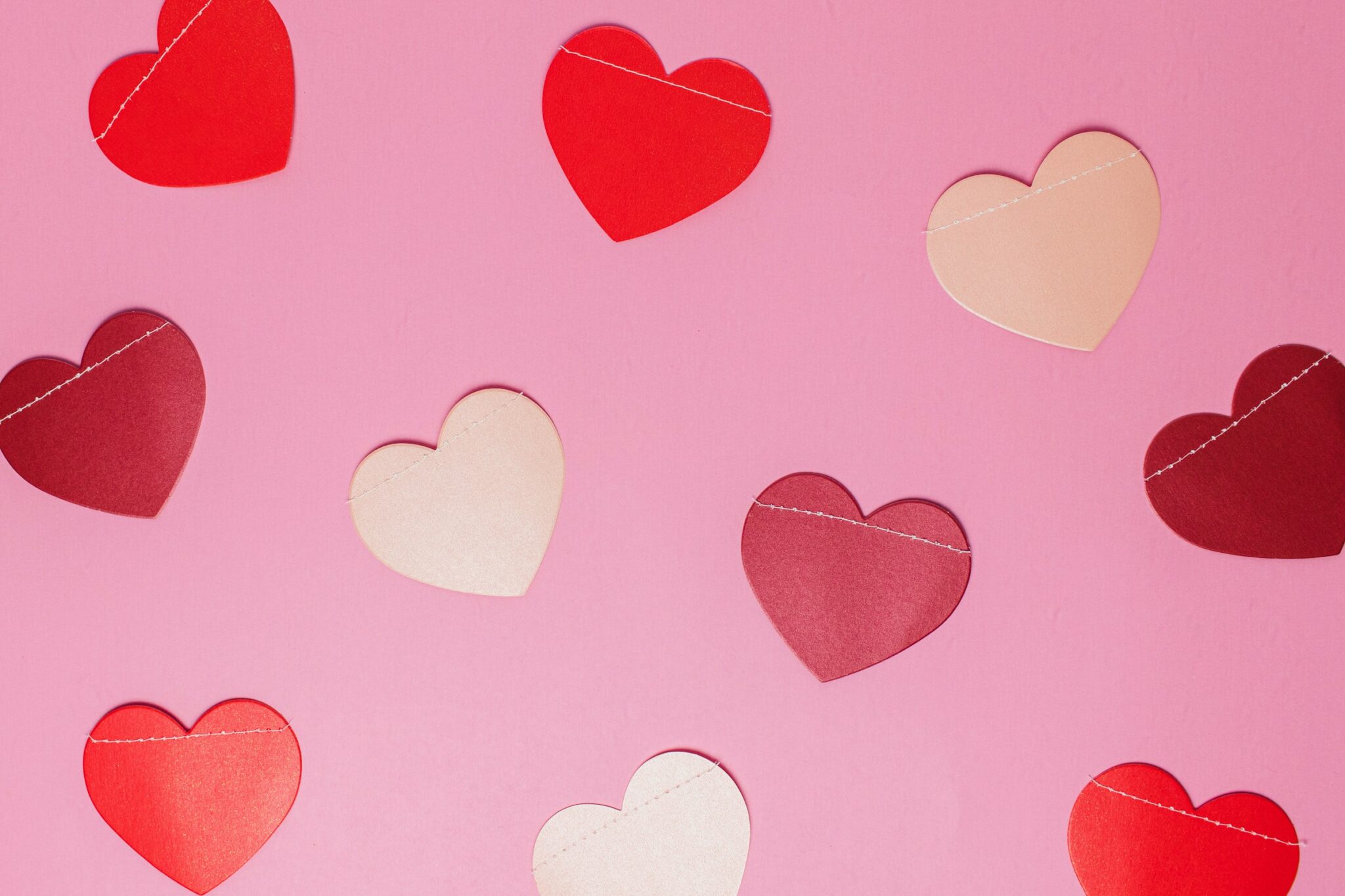 red and white hearts on pink background