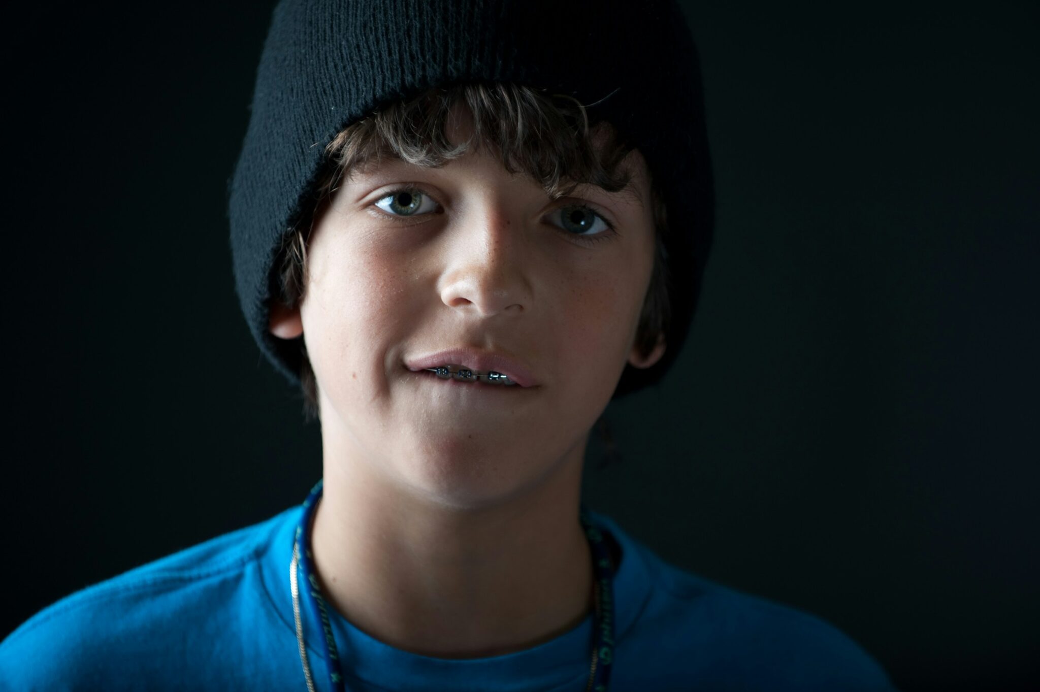 Boy wearing a cap and braces